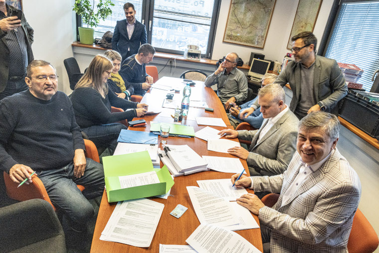 People sitting at a large work table